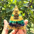 Macro detail of resin pyramid with golden Buddha, malachite, and lapis lazuli in sunlight - Style 22
