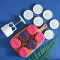 Macro view of 100g round mooncake press tool with interchangeable flower pattern stamps - Round Set 5 (6 Patterns)