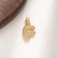 Detailed view of gold plated F letter pendant with sparkling white cubic zirconia stones - Letter F