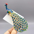 Elegant peacock brooch with blue enamel and sparkling crystals in a golden alloy finish - DW1056 Peacock / 132*36mm / Blue
