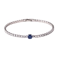Close-up of silver tennis bracelet with circular cubic zirconia and a blue center stone - Silver Base Blue Zirconia