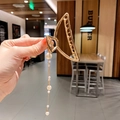 Golden hollow metal hair claw clip with long pearl chain tassel pendant in hand - Pearl Pendant Semicircle / Gold