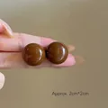 Detail view showing spherical resin earrings in caramel leopard print measuring 2cm by 2cm - Brown Flat Ball (117#) / Brown