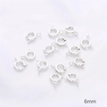 6mm silver spring ring clasps for jewelry making displayed on a white textured surface - 6mm Spring Clasp / Silver