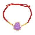Detail of red woven rope bracelet with purple Buddha pendant and gold bead accents - Purple