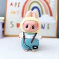 Labubu plush doll in yellow bunny hoodie with white shirt and blue overall pants - Crown Belt Overalls Set In Blue / First And Second Generation Keychains Are Compatible With La Cloth Dolls. Dolls Not Included.