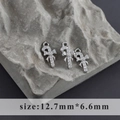 Detail of candy cane charms with rhodium plating and white zircon bow accents - Candy Cane Style (M100309)