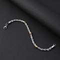 Detail of a 5mm stainless steel rope chain bracelet with gold beads and lobster clasp - Bracelet (21cm)
