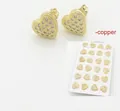 Golden heart-shaped stud earrings with honeycomb pave cubic zirconia and copper base - Zircon Heart