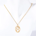 Close-up of golden number 8 pendant with crystal on mannequin neck - Taurus