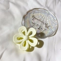 Pale yellow flower hair claw clip with matte finish on decorative shell tray - Matte White