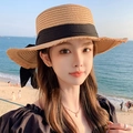 Women's light brown straw sun hat with black bow, perfect for beach vacation and sun protection - Flat Top Hemp Ribbon Khaki Black