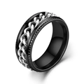 Macro view of a black titanium steel spinner ring featuring a rotatable silver chain inlay - Black Band with Silver Chain