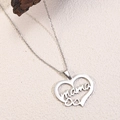 Macro shot of silver stainless steel heart necklace featuring a hollow mama letter design - Letter Mama Silver Heart Style (D10)