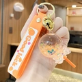 Orange lollipop keychain with glowing sand, glitter sequins and Good luck strap - Noctilucent Bubble Bead Lollipop-Orange