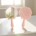 Pink rose shaped handheld makeup mirror showing front mirror and floral back design - Lotus Pink