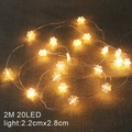 2M string of 20 warm LED snowflake lights on rustic burlap background - Snowflake/2M 20LED