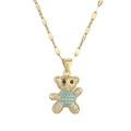 Collana a forma di orsetto dorato con zirconi turchesi su sfondo bianco professionale - Oro Turchese