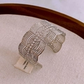 Silver-plated open hollow cuff bracelet with geometric patterns on linen backdrop - Silver Wide Hollow Pattern (HB3349)