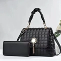 Close-up of black quilted bucket bag and matching wallet with metallic tassel detail - Large Bag and Wallet Set / Black