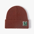 Winter knit beanie in rust red with letter N patch, stylish thermal rib-knit cold cap - Rust red