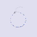 Macro detail of stainless steel silver chain bracelet with blue enamel oval beads and clasp - Steel + Royal Blue