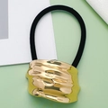 Elastic black hair tie featuring a large irregular hammered gold metal ornament - Style 14 (Gold Irregular Hammered)