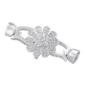 Dettaglio macro della chiusura a fiore argento con strass lucidi per creazione gioielli - Chiusura a petalo in platino VK269