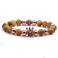 Detalle de corona de oro rosa con microincrustaciones en pulsera de piedra ojo de tigre - Ojo de Tigre Dorado Oro Rosa