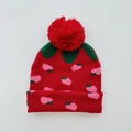 Detail of red strawberry knit hat featuring a fluffy pom-pom and green leaf patterns - Under 7 Years / Red