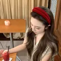Red velvet padded headband for women with non-slip flocking texture on a model - Red