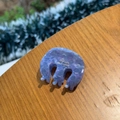 Close-up of lavender marble acetate claw clip with 'Barrette La France' text on wood - Oval M Small Claw / Blueberry Purple