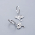 Macro detail of S925 sterling silver hoop earrings with polished elephant charms - Elephant Head Earrings - Silver