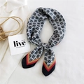 Black and white floral geometric silk scarf with red gold contrast trim on casual outfit - Checkered Flowers Black Edge