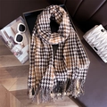 Classic brown plaid cashmere-feel winter scarf with fringes styled on a sofa - Brown Beige & Black Houndstooth (WT185-3)