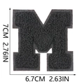 Macro view showing 7x6.7cm dimensions for black chenille letter M embroidered patch - Letter M / Black