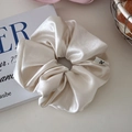Oversized champagne satin scrunchie with a minimalist woven label for a balletcore look - Glossy Off-white