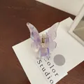 Elegant butterfly hair claw clip with purple pearlescent finish and gold metal spring - Lavender