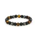 Adjustable tiger eye stone and matte black beaded bracelet in a circular display - Tiger Eye + Polished Stone + Hematite
