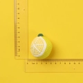 Handmade crochet lemon keychain pendant with yellow yarn and green leaves size reference - Yellow Knitted Lemon