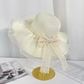 Elegant beige straw sun hat featuring a large lace bow and pleated organza brim detailing - Cream Lace Bowknot