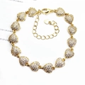 Detailed view of heart-shaped gold bracelet with micro-pave zircons and lobster clasp - Linked Hearts / Gold
