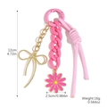 Porte-clés marguerite rose avec nœud doré longueur douze cm et poids seize grammes total - K2508-2 Noeud Doré