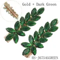 Elegant gold finish hair clip with dark green marquise gems in leaf branch design - Gold + Dark Green