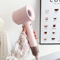 Pink high-speed bladeless hair dryer with negative ion technology in a lifestyle setting - Girl Pink