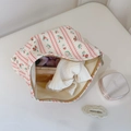 Close-up of floral strawberry print cotton makeup bag with metal zipper opening - Pink Striped Floral