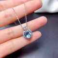 Exquisite silver necklace featuring a heart-shaped sky blue gemstone and halo diamonds - Aquamarine Tz-36