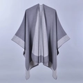 Detail of grey and light grey two-tone knit shawl poncho with professional split drape - Dark and Light Grey