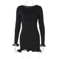 Detail showing white ruffled trim and cuffs on a black bodycon long sleeve dress - S / Black