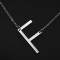 Elegant silver necklace with a minimalist letter F pendant made of stainless steel - White Letter F